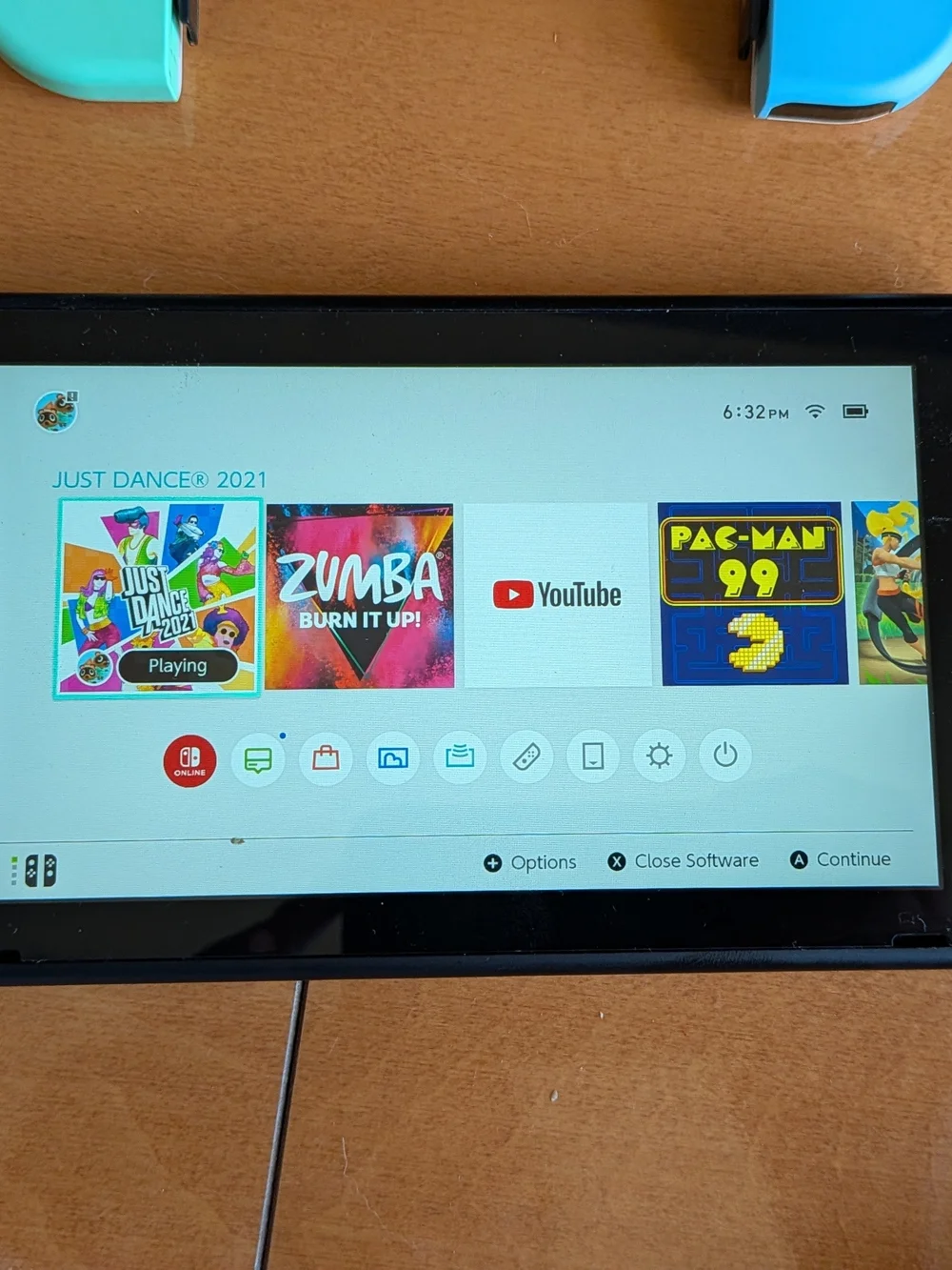 Nintendo Switch with Bright Turquoise and Cyan Joy-Con. Two Games Included